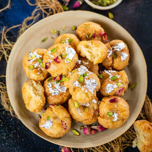 Load image into Gallery viewer, Balushahi Sweet | Balushahi | Badusha | premium balushahi topped with pistachio on table | YumBasket
